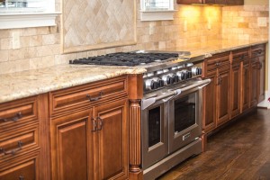 home appliance photo of oven stove and countertops in the kitchen