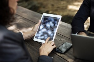 woman playing on her smartphone tablet